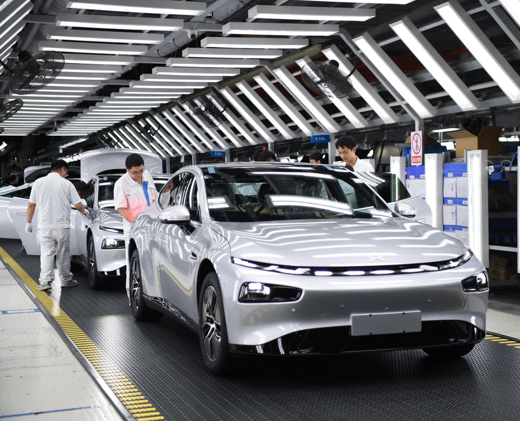 Workers conduct final checks on an Xpeng new energy car at the firm’s plant in Zhaoqing, Guangdong province, on October 9, 2023. Photo: Xinhua