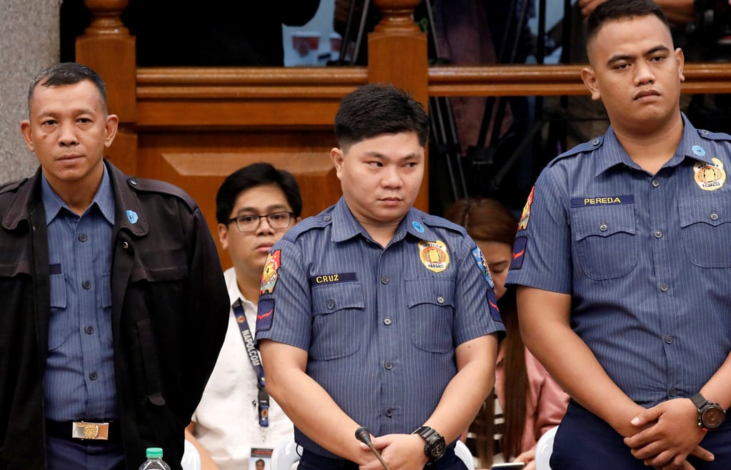 Police officers (from left) Arnel Oares, Jerwin Cruz and Jeremias Pereda stand during a Senate hearing on September 5, 2017. Photo: Reuters