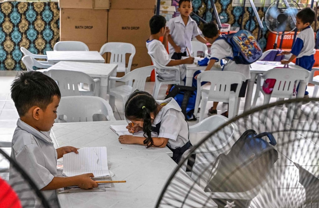 Students work on activities at an elementary school at Baseco in Manila. Photo: AFP