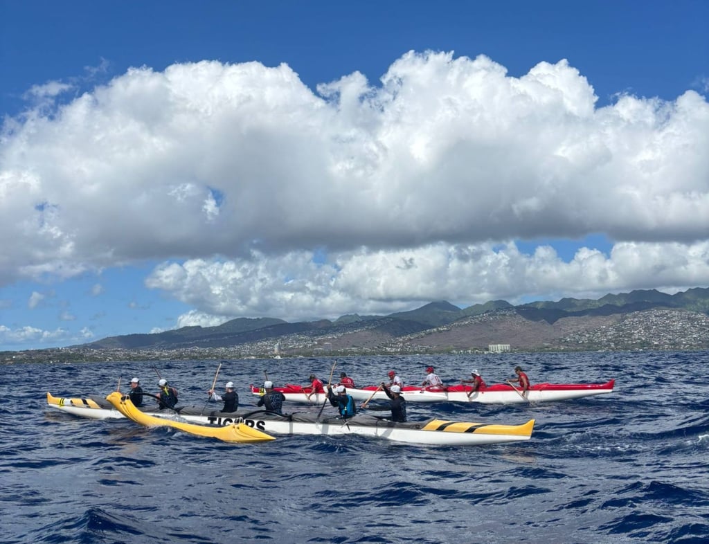 The Hong Kong outfit (yellow) competed in Hawaii’s Molokai Hoe, a 66km channel crossing. Photo: Handout