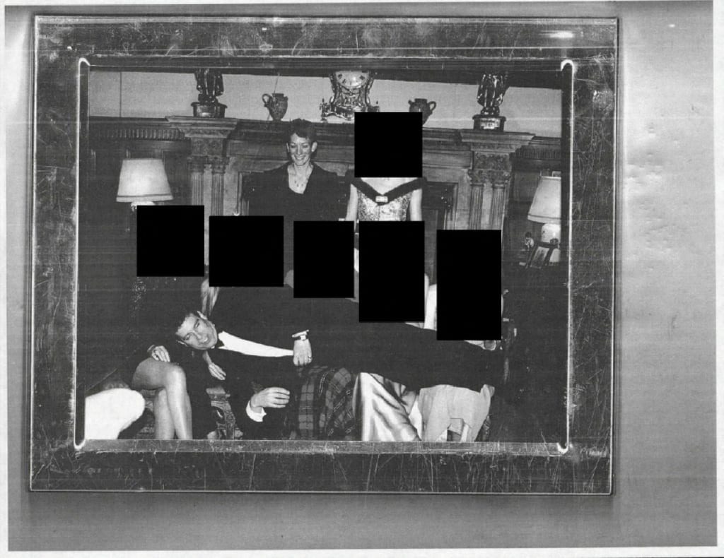 A redacted photo showing Andrew Mountbatten-Windsor laying across several people’s laps with Ghislaine Maxwell standing above. Photo: US Department of Justice via AP A redacted photo showing Andrew Mountbatten-Windsor laying across several people’s laps with Ghislaine Maxwell standing above. Photo: US Department of Justice via AP