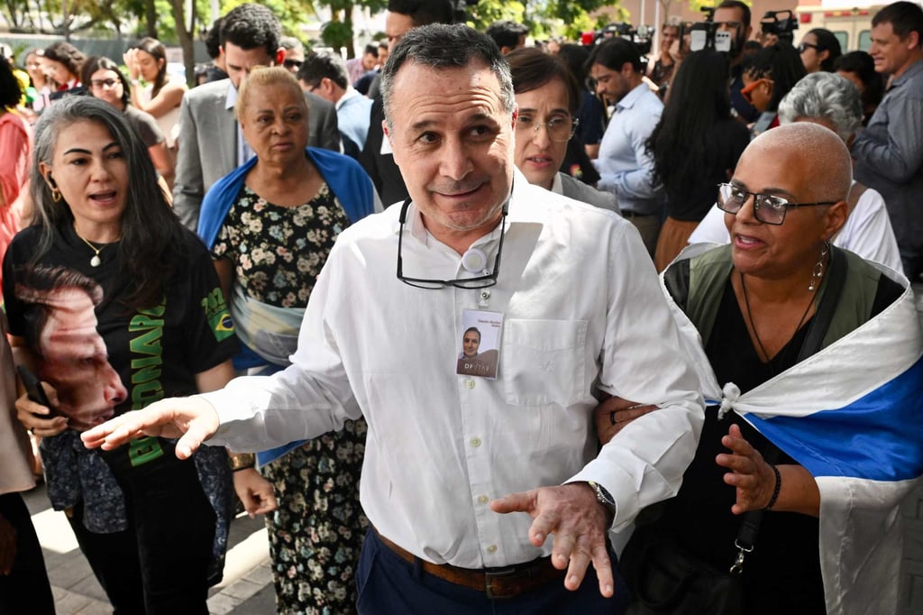 Former Brazilian president Jair Bolsonaro’s doctor, Claudio Birolini, gestures after speaking with the press in Brasilia on Thursday. Photo: AFP