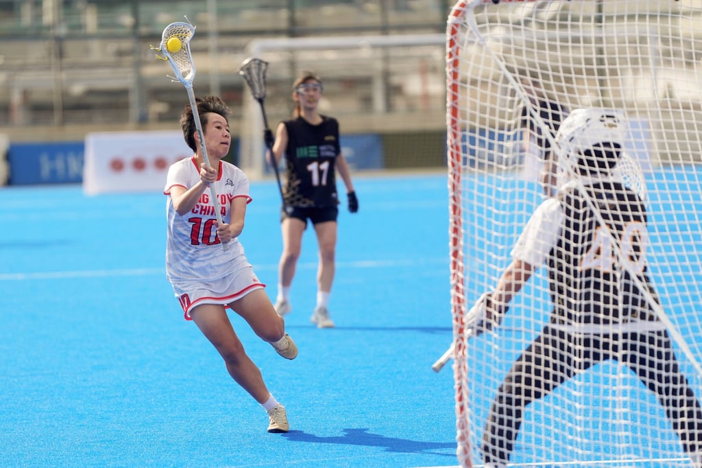Cheng Sum-yuet of Hong Kong’s women’s team (left) goes for goal against Ratels. Photo: Elson Li Cheng Sum-yuet of Hong Kong’s women’s team (left) goes for goal against Ratels. Photo: Elson Li