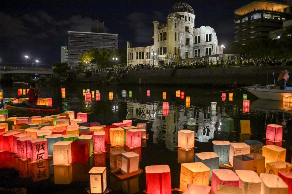 People attend a lantern-floating ceremony at the Hiroshima Peace Memorial Park in Japan. Photo: Getty Images People attend a lantern-floating ceremony at the Hiroshima Peace Memorial Park in Japan. Photo: Getty Images