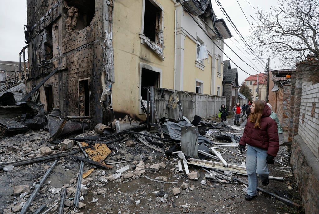Residents inspect the damages at the site of a Russian strike on a private building in Kyiv, Ukraine on Saturday. Photo: EPA