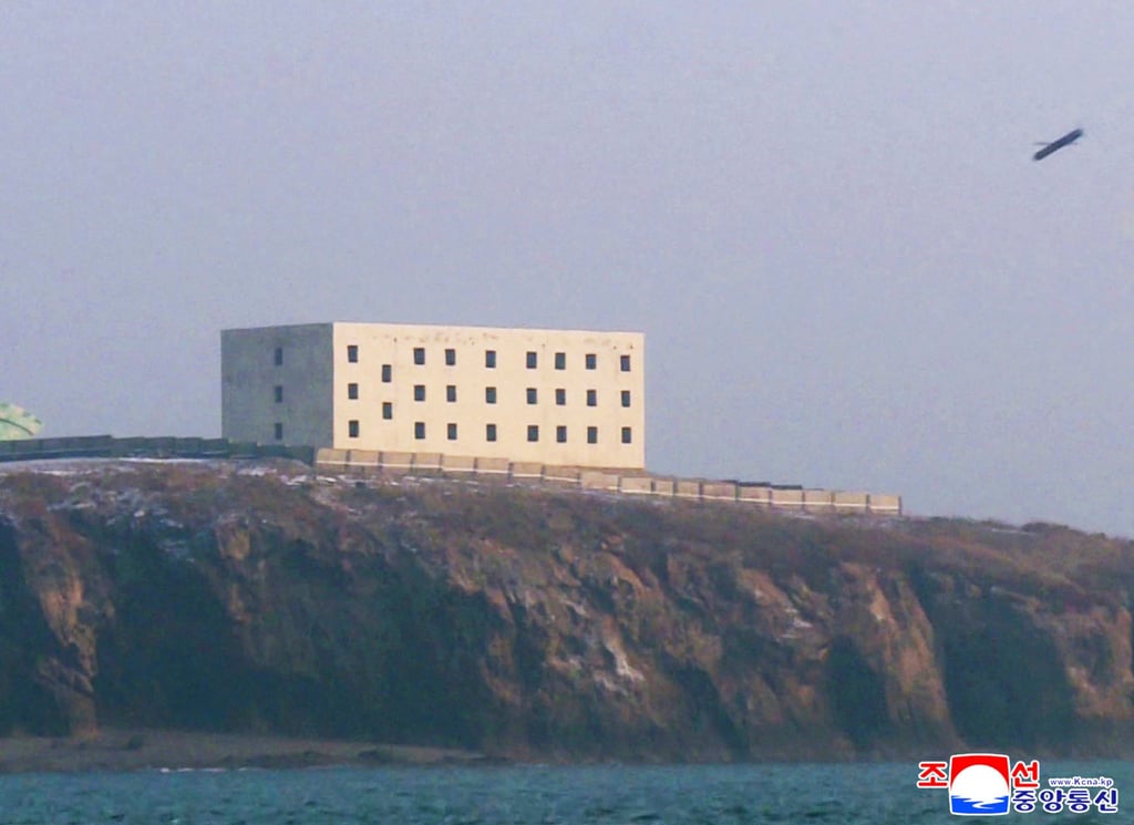 A missile moments before hitting its target. Photo: KCNA via AFP