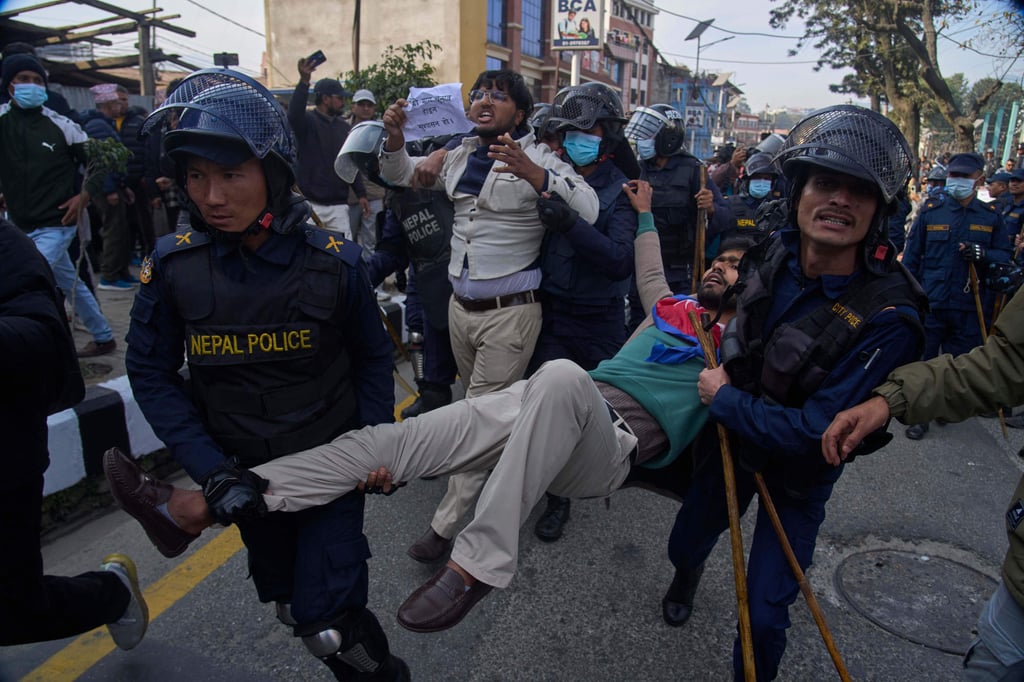 Nepalese police detain a protester during an anti-government rally in Kathmandu on December 22. Photo: AP