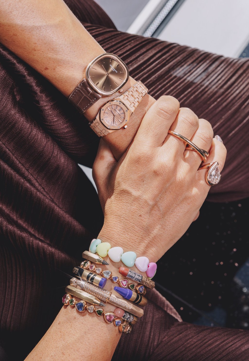 Nadine Ghosn pairs a Patek Philippe Ellipse with an Audemars Piguet Mini Royal Oak on her left wrist, and stacks her own bracelets on the right. Photo: Jocelyn Tam Nadine Ghosn pairs a Patek Philippe Ellipse with an Audemars Piguet Mini Royal Oak on her left wrist, and stacks her own bracelets on the right. Photo: Jocelyn Tam