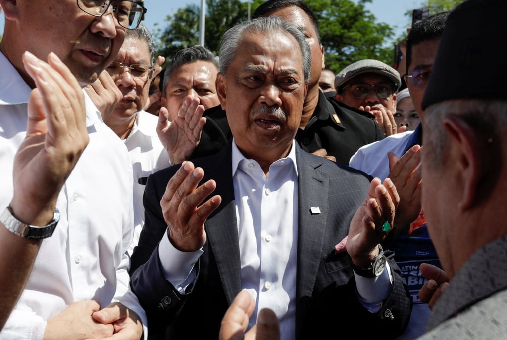 Former Malaysia Prime Minister Muhyiddin Yassin arrives to give a statement to the Malaysian Anti-Corruption Commission (MACC) in Putrajaya in March 2023. Photo: Reuters