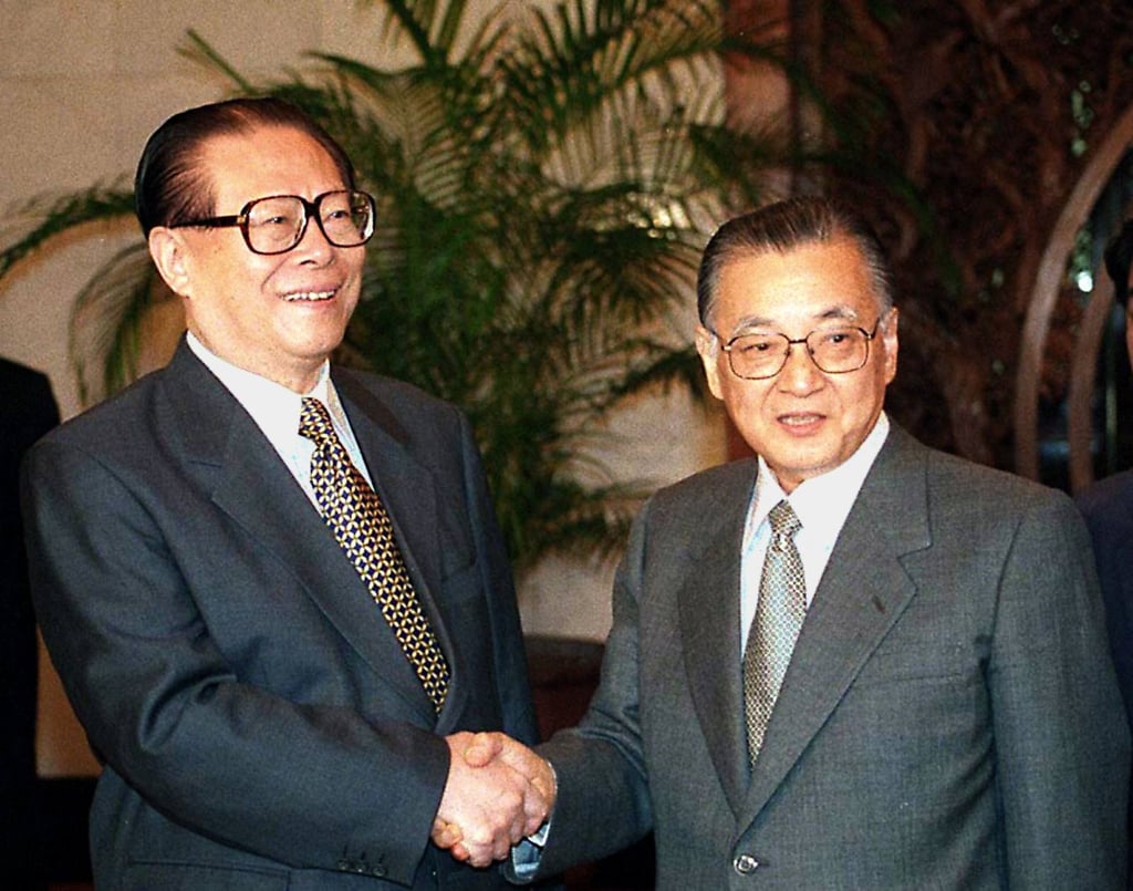Fuwa (right) shakes hands with Chinese President Jiang Zemin during a meeting in Beijing in 1998. Photo: AFP Fuwa (right) shakes hands with Chinese President Jiang Zemin during a meeting in Beijing in 1998. Photo: AFP