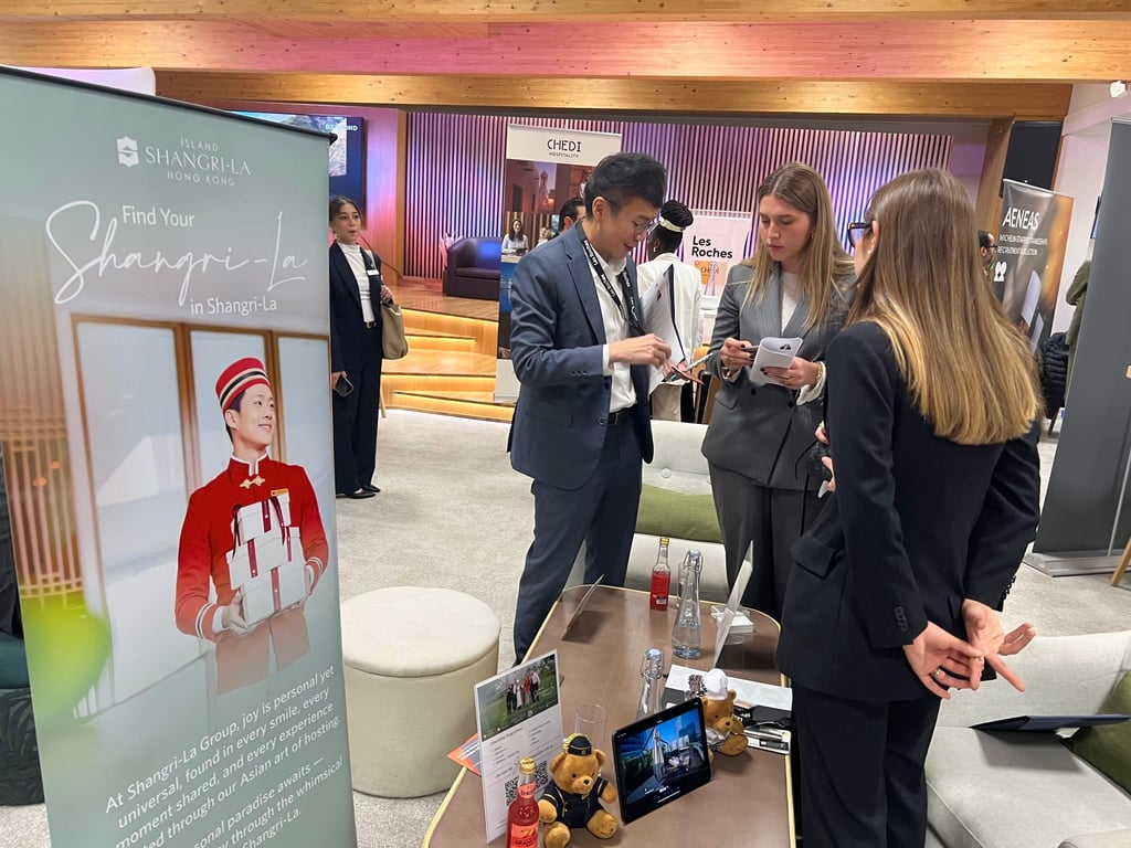 An Island Shangri-La Hong Kong representative meets with candidates at a career fair in Switzerland.