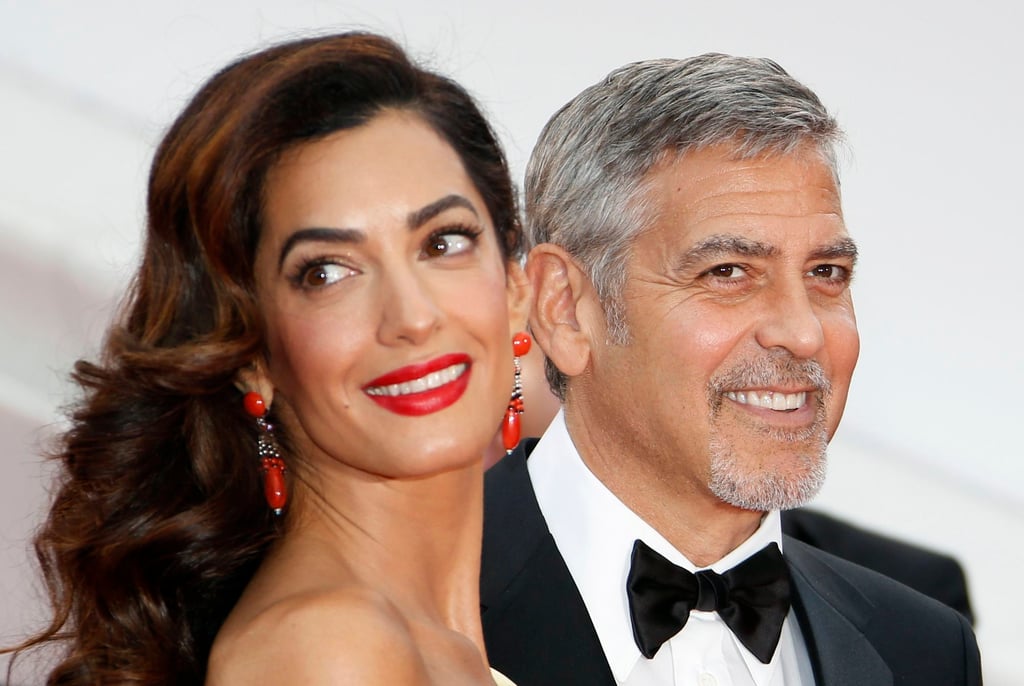 George Clooney (right) and wife Amal Clooney (L) arriving for the screening of “Money Monster” during the 2016 Cannes Film Festival in France. Photo: EPA