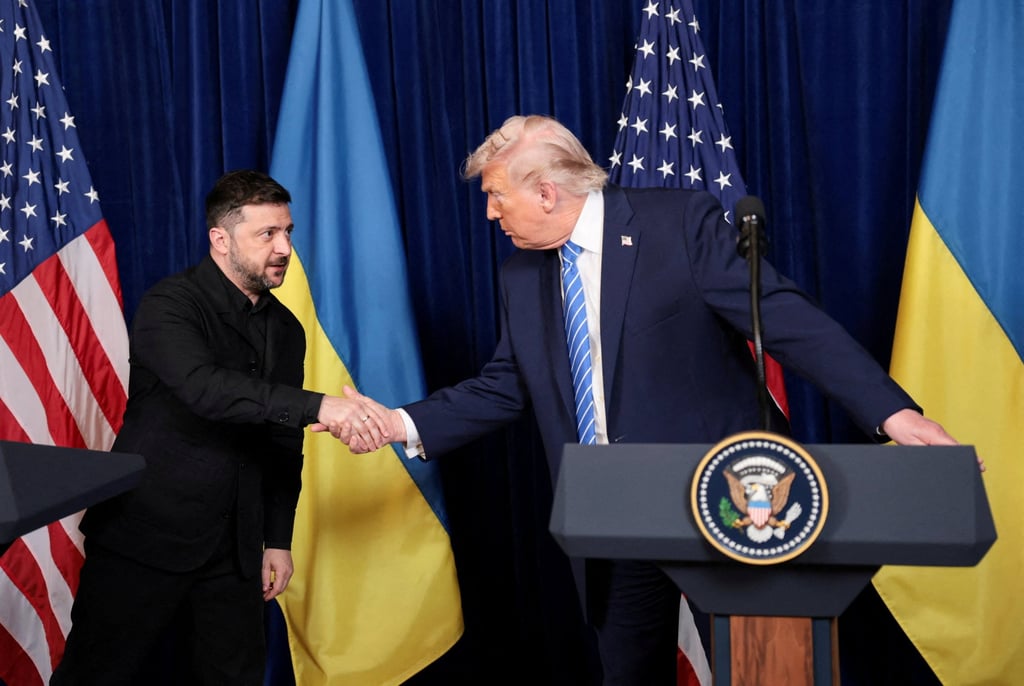 US President Donald Trump (right) and Ukrainian President Volodymyr Zelensky shake hands during a press conference at Trump’s Mar-a-Lago club, in Palm Beach, Florida on Sunday. Photo: Reuters US President Donald Trump (right) and Ukrainian President Volodymyr Zelensky shake hands during a press conference at Trump’s Mar-a-Lago club, in Palm Beach, Florida on Sunday. Photo: Reuters