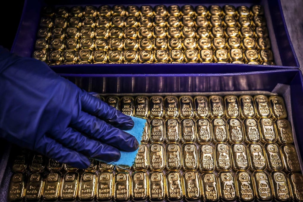 As global tensions rise in various regions, investors are turning to gold for security. Photo: AFP