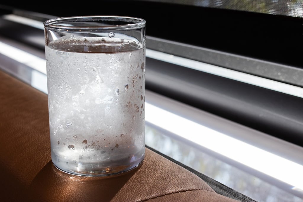 A cold glass of water by the window. Many Chinese believe that drinking warm water is good for one’s health. Photo: Shutterstock A cold glass of water by the window. Many Chinese believe that drinking warm water is good for one’s health. Photo: Shutterstock