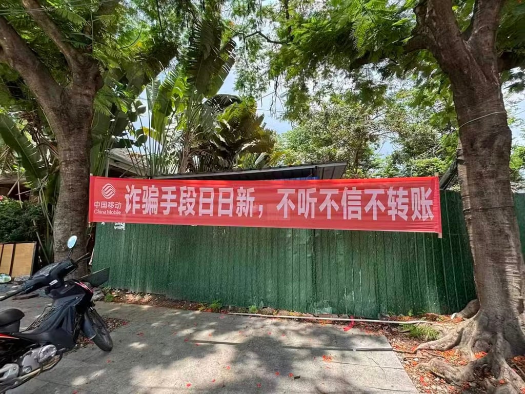 A banner warning against scams at Menglian border port in China’s Yunnan province. It reads: “Scam tactics change daily – don’t listen, don’t believe, don’t transfer”. Photo: Xu Peng