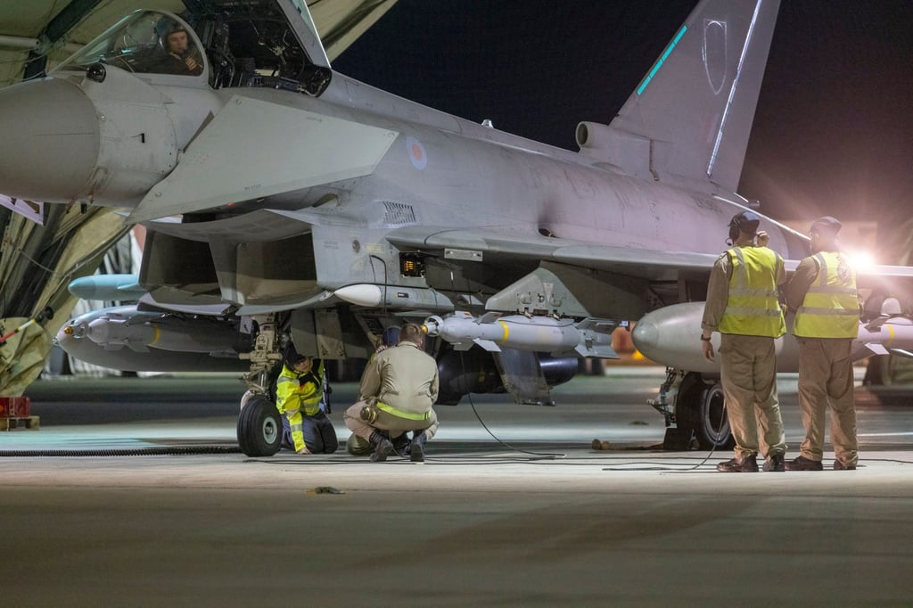 Britain’s Royal Air Force personnel prepare a Typhoon fighter jet for take-off at an undisclosed location in the Middle East on Saturday. Photo: EPA Britain’s Royal Air Force personnel prepare a Typhoon fighter jet for take-off at an undisclosed location in the Middle East on Saturday. Photo: EPA