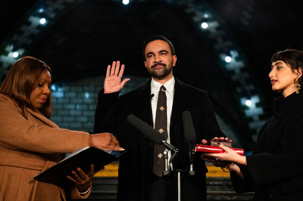 Zohran Mamdani places his hand on two Korans, held by his wife Rama Duwaji, as he is sworn in as mayor by New York Attorney General Letitia James, in the early hours of New Year’s Day. Photo: AFP