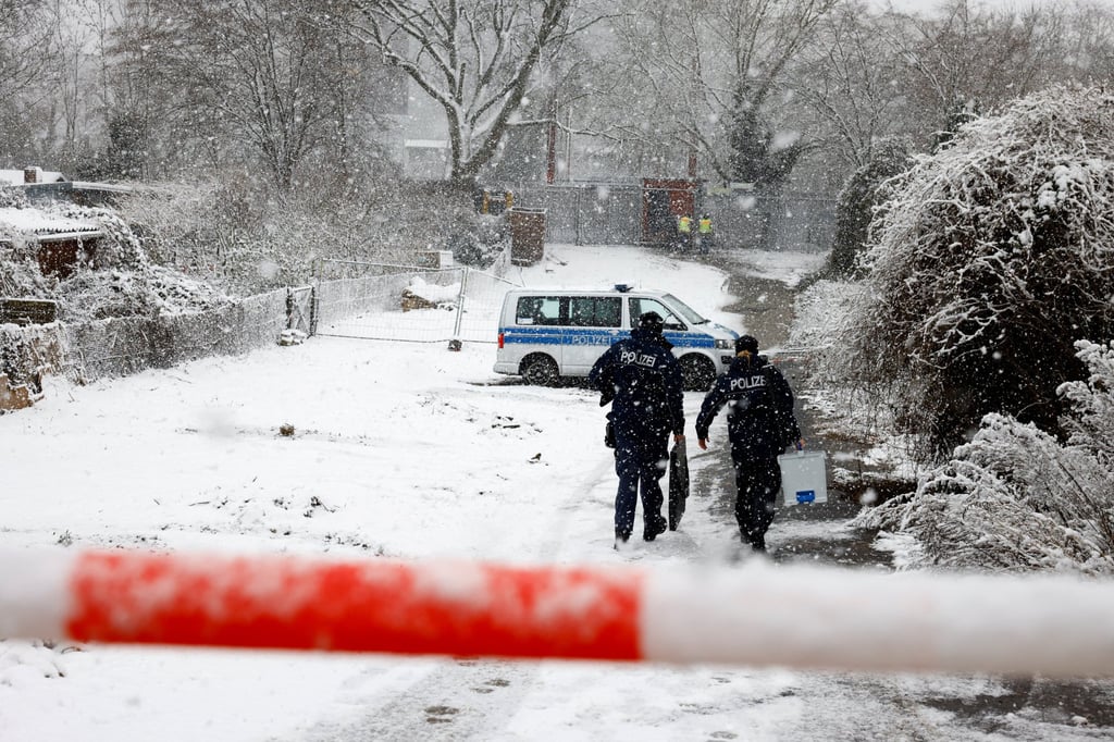 Police officers outside a power distribution system that caught fire. Photo: Reuters Police officers outside a power distribution system that caught fire. Photo: Reuters