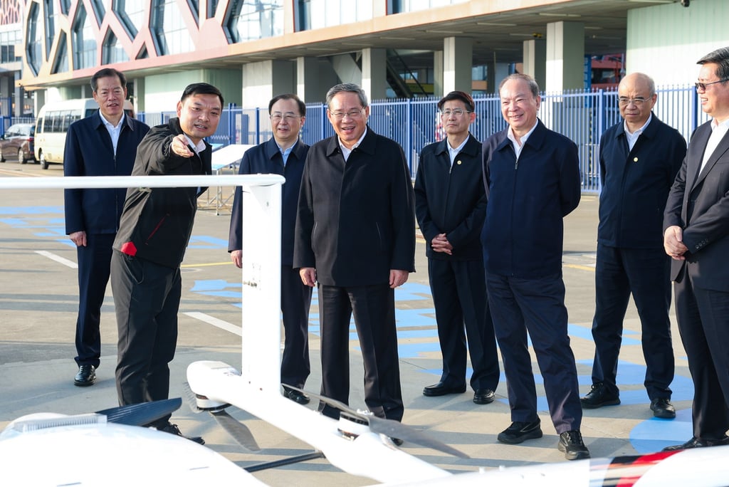 Premier Li Qiang, fourth left, learns about drone development in Shenzhen on January 4, 2026. Photo: Xinhua