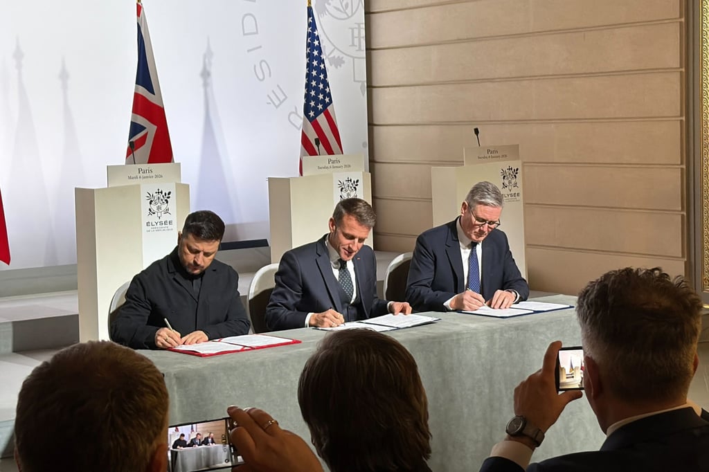 (From left) Ukraine’s President Volodymyr Zelensky, France’s President Emmanuel Macron and Britain’s Prime Minister Keir Starmer sign the declaration on deploying a post-ceasefire force in Ukraine in Paris on Tuesday. Photo: dpa