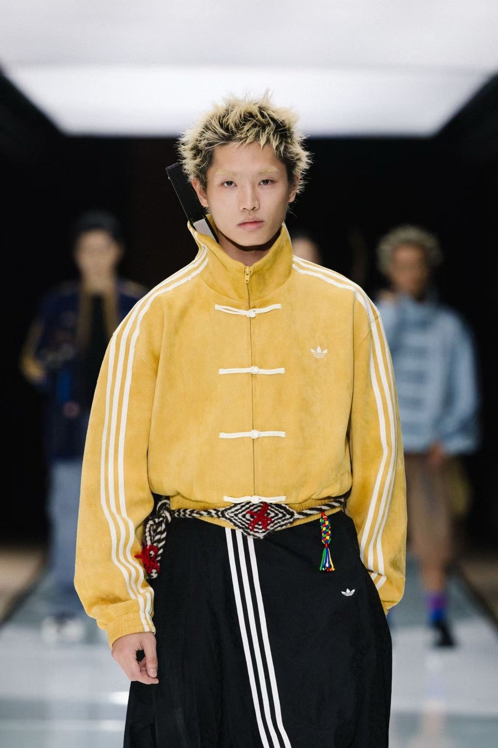 A model wears Adidas’ “Tang-style” jacket that combines streetwear cool with Chinese details including “frog buttons”. The jacket has become a viral hit on social media. Photo: Adidas Power of Three A model wears Adidas’ “Tang-style” jacket that combines streetwear cool with Chinese details including “frog buttons”. The jacket has become a viral hit on social media. Photo: Adidas Power of Three
