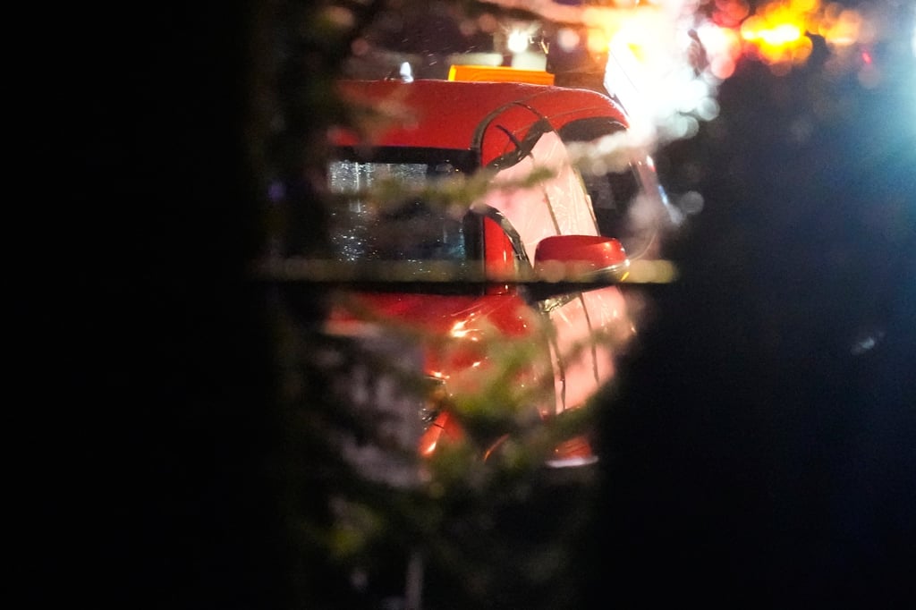 Damage to a red truck at a residential complex as it is towed following the shooting in Portland. Photo: AP Damage to a red truck at a residential complex as it is towed following the shooting in Portland. Photo: AP