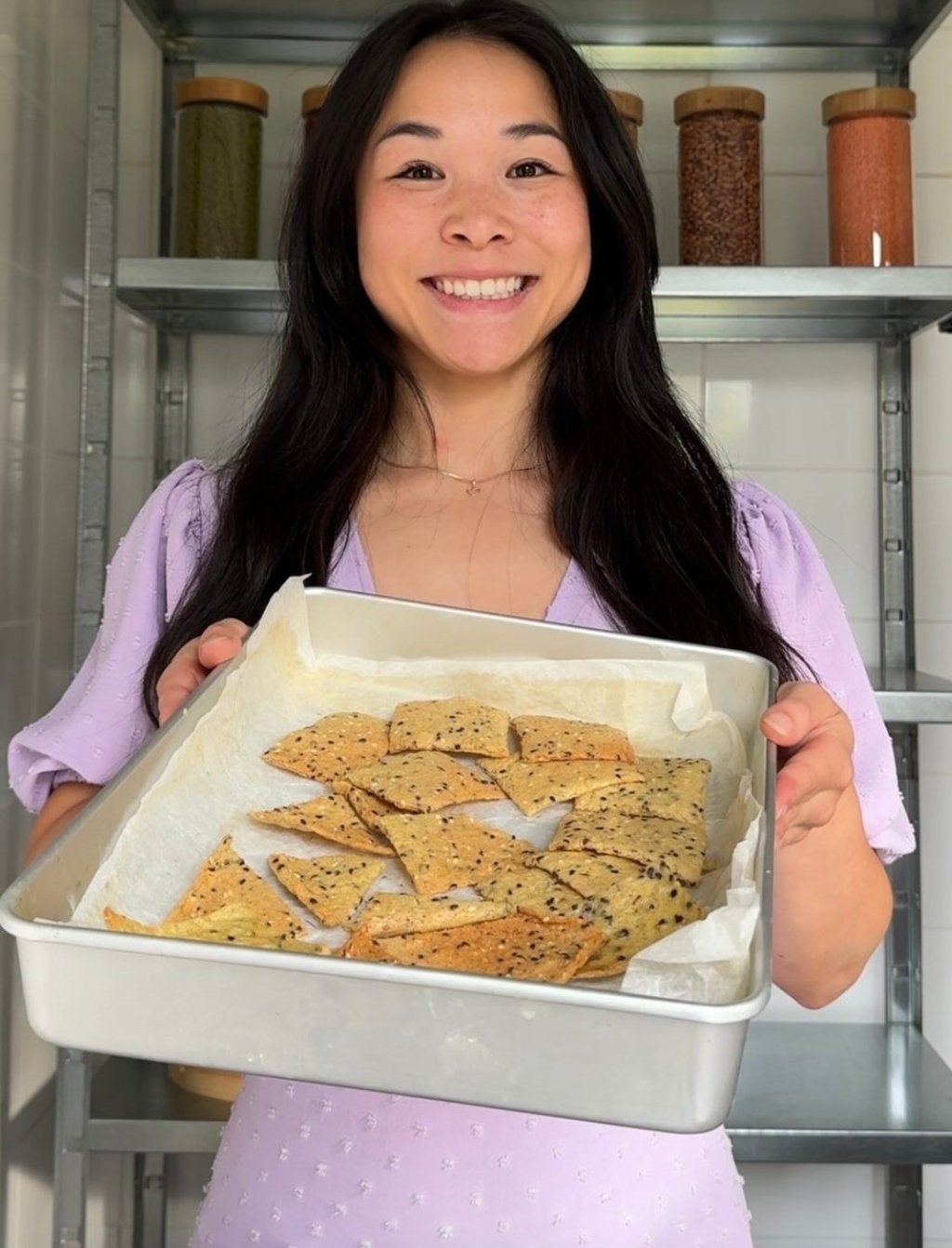 Luong holds a pan of crispy lentil crackers that are simple to make. Photo: Instagram/wendythefoodscientist Luong holds a pan of crispy lentil crackers that are simple to make. Photo: Instagram/wendythefoodscientist