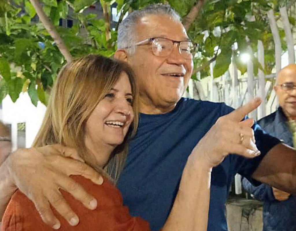 Former Venezuelan presidential candidate Enrique Marquez embracing his wife, Sonia Lugo, after his release. Photo: Frederick Villegas via AFP