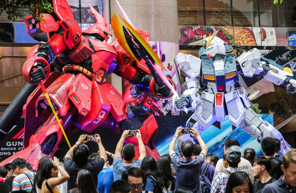 Onlookers take pictures of a “Gundam”-themed exhibit in Hong Kong in 2018. Photo: Felix Wong