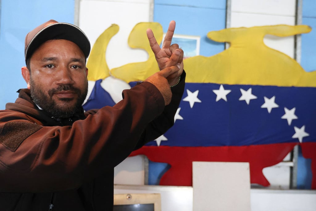 Willians, a member of “Boina Roja” or Red Beret, in Caracas on Tuesday. The “colectivos” have closed ranks behind Delcy Rodriguez, who took over as interim president. Photo: AFP