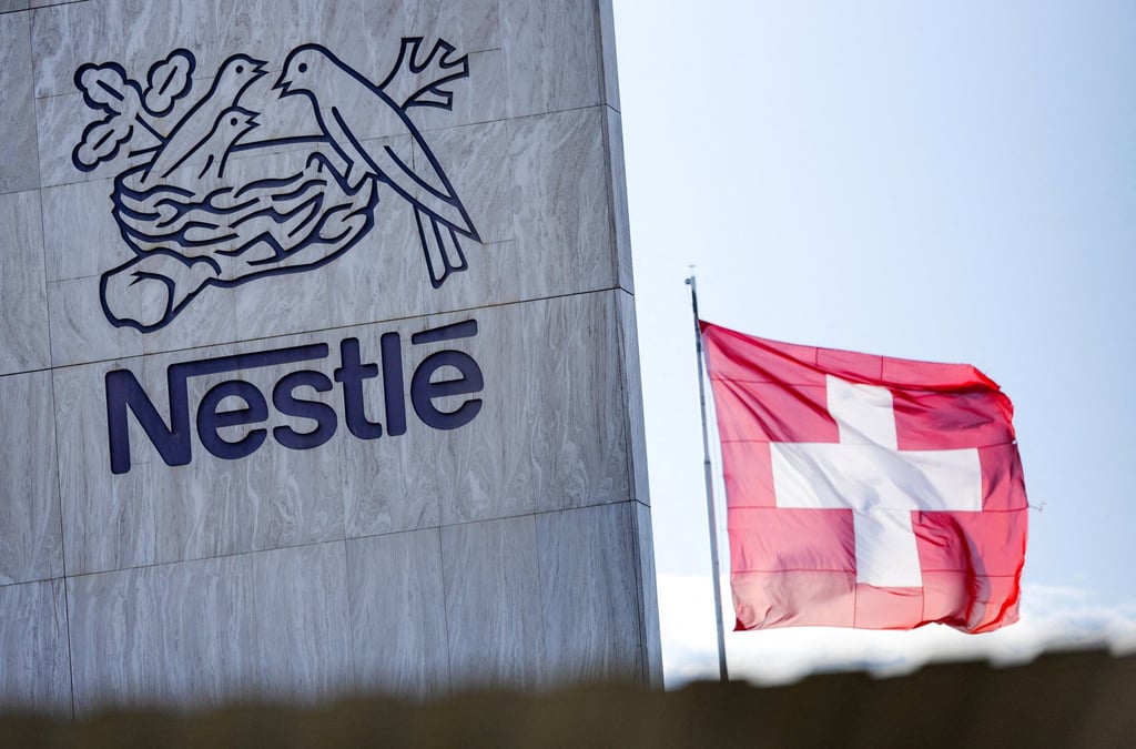 A Swiss flag flutters on the headquarters of Nestle in Vevey, Switzerland. Photo: Reuters