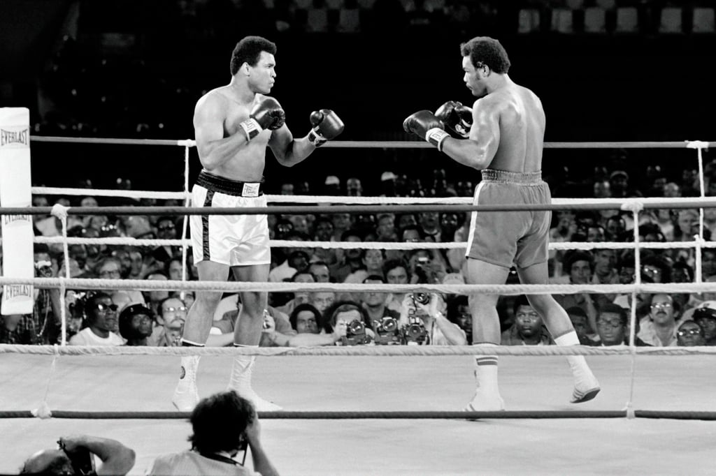 The “Rumble in the Jungle” fight between Muhammad Ali (left) and George Foreman took place in Kinshasa, Zaire (now the Democratic Republic of Congo) in October 1974. Photo: TNS
