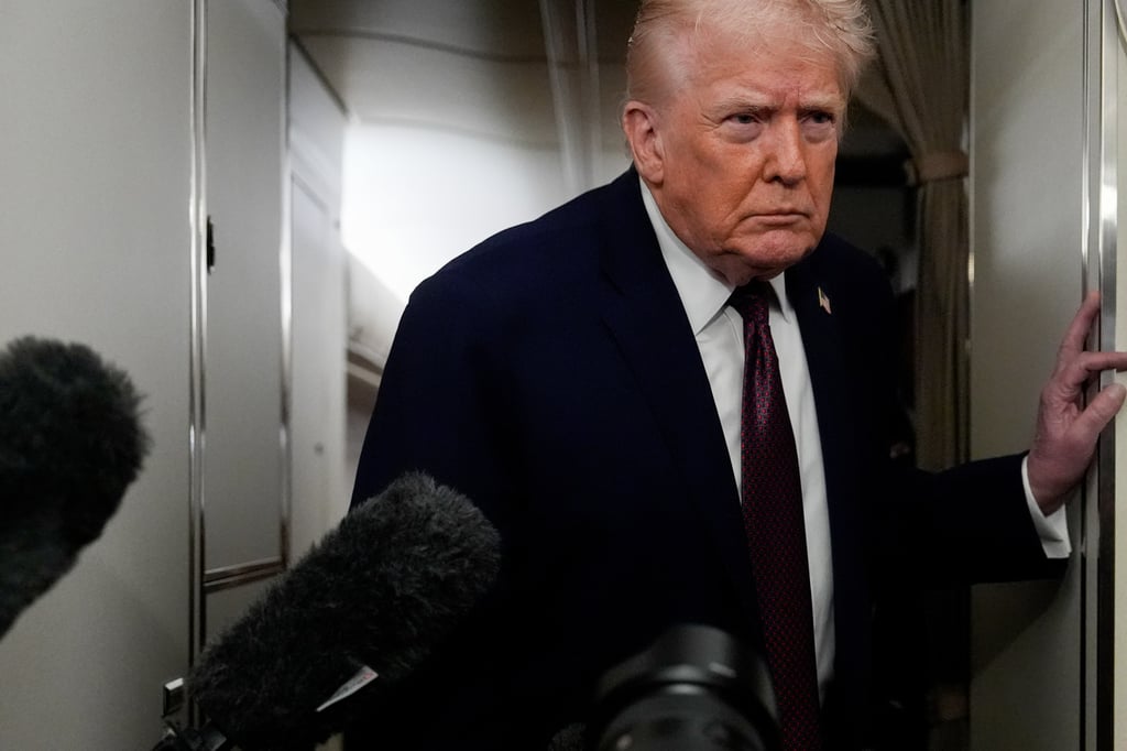 US President Donald Trump on Air Force One on Sunday. Photo: AP