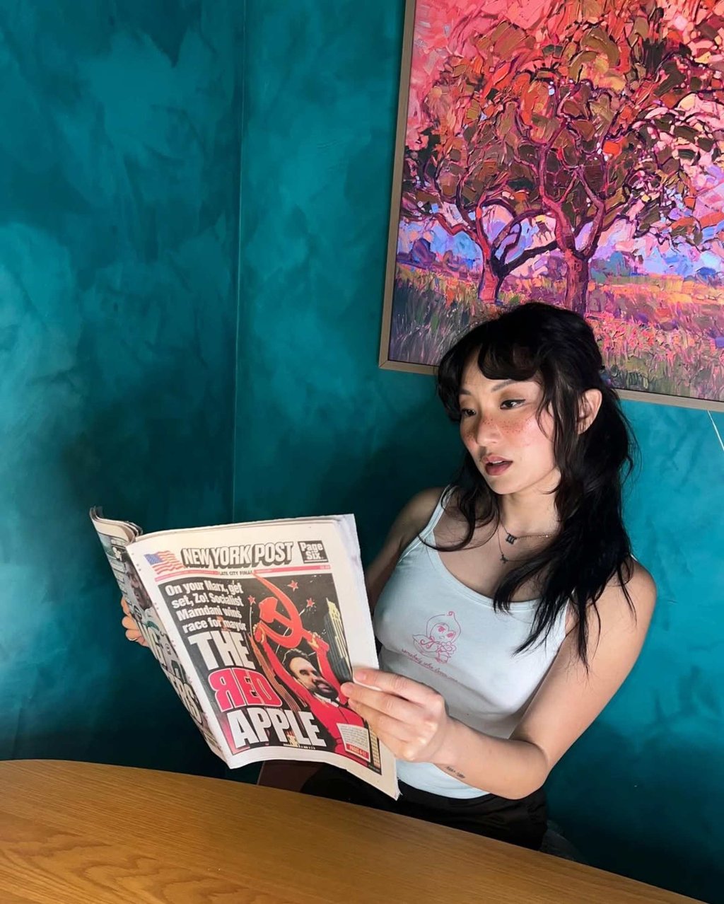 Poppy Liu holding a mock New York Post cover celebrating Zohran Mamdani’s mayoral win. Photo: @ashluka/Instagram Poppy Liu holding a mock New York Post cover celebrating Zohran Mamdani’s mayoral win. Photo: @ashluka/Instagram