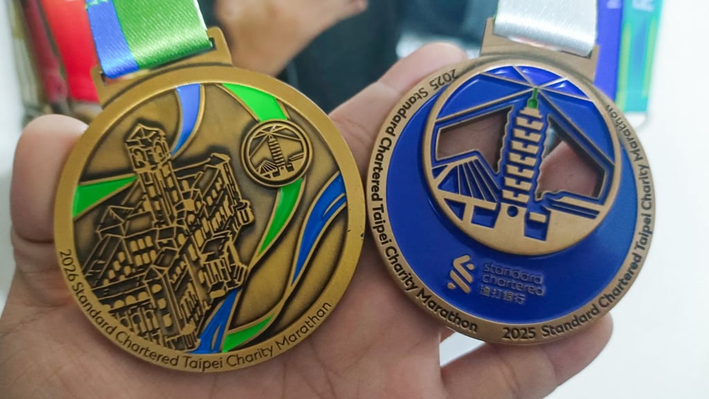 This year’s Taipei Charity Marathon finishers’ medal compared with last year’s. Photo: handout
