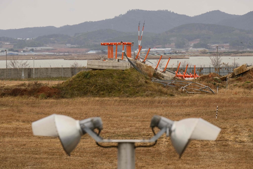 The damaged concrete structure is seen at the end of the runway at Muan International Airport, where Jeju Air Flight 2216 crashed in December 2024. Photo: AFP