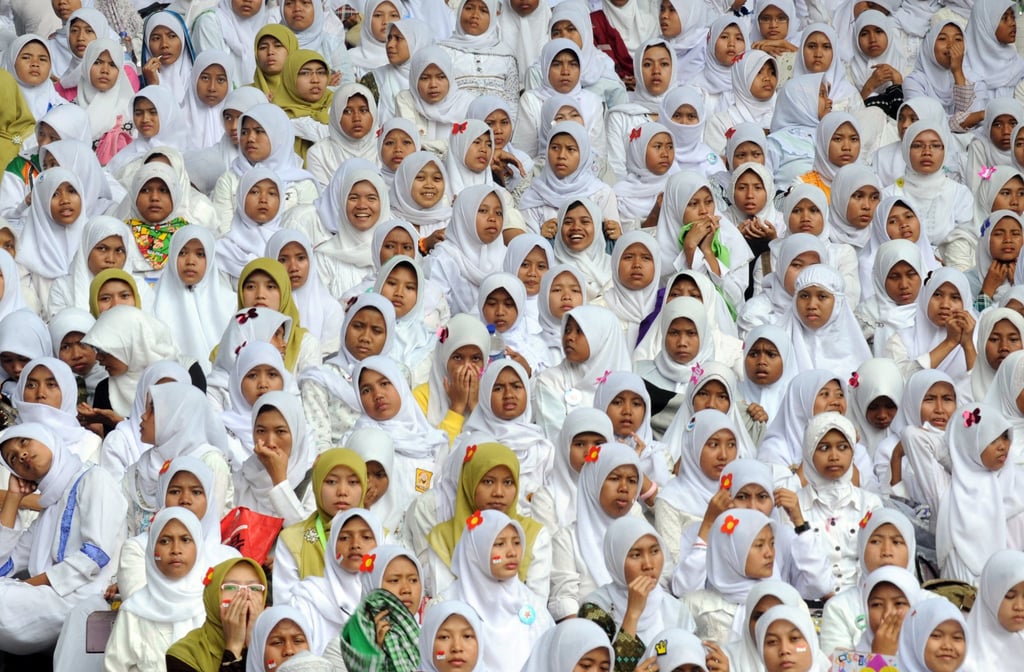 Young women attend a ceremony in Jakarta in 2011 marking the 85th anniversary of the Nahdlatul Ulama organisation. Photo: AFP