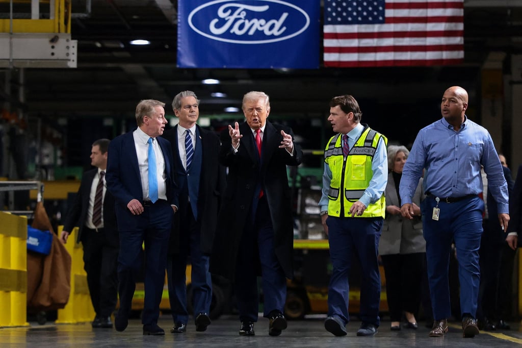 US President Donald Trump touring the auto plant. Photo: Reuters