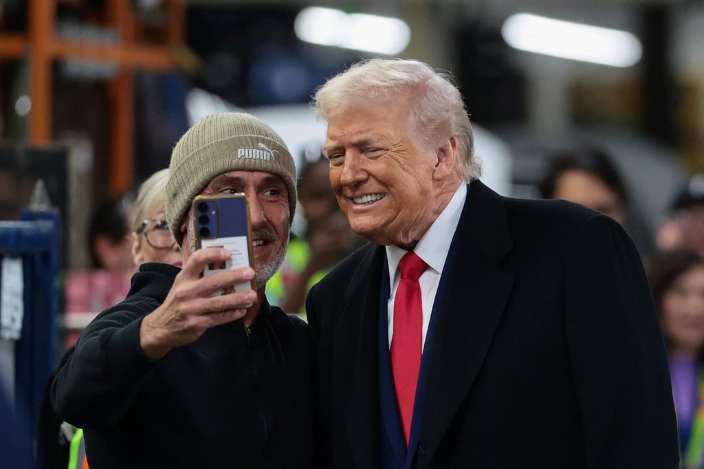 US President Donald Trump poses for a photo with a worker, as he visits a Ford production centre in Dearborn, Michigan, on Tuesday. Photo: Reuters