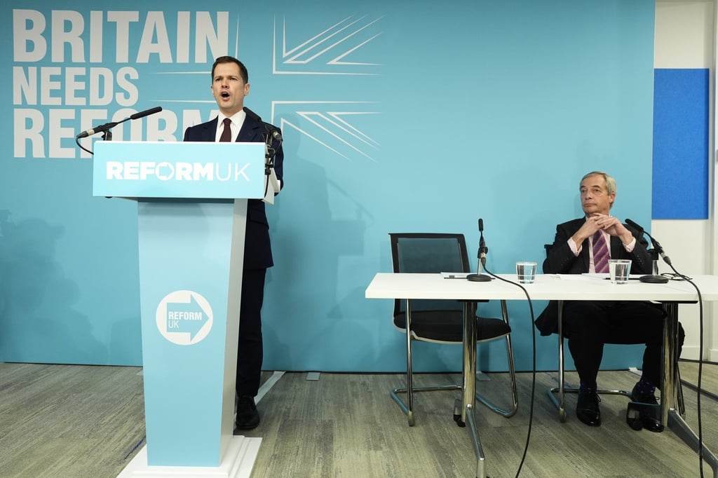 Robert Jenrick speaking alongside Nigel Farage at a press conference. Photo: PA Wire via dpa