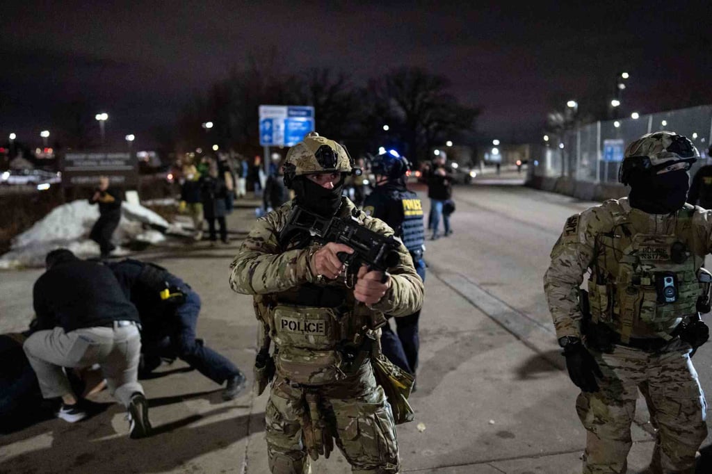 Federal immigration officers detain a protester outside the Bishop Henry Whipple Federal Building in Minneapolis. Photo: AP
