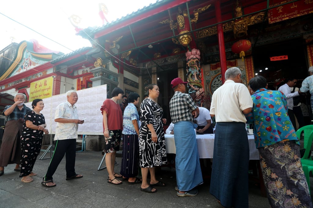 Voters arrive in Yangon to cast ballots during the second phase of Myanmar’s election on Sunday. Photo: EPA