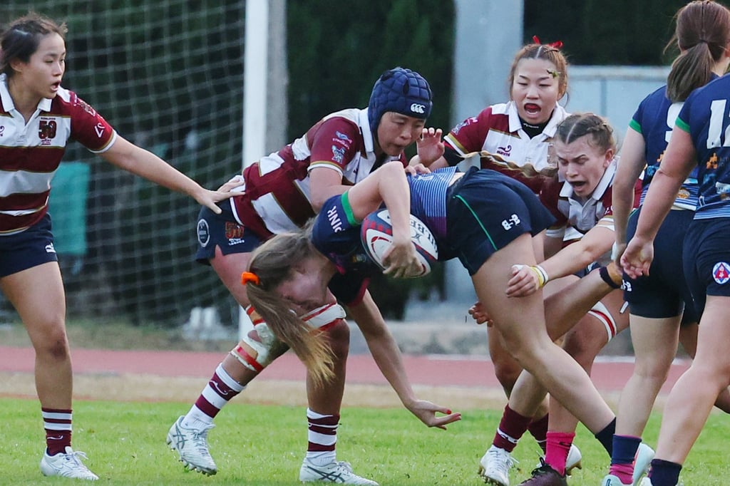 Tsang Sin-yan (centre) tackling a Causeway Sandy Bay opponent. Photo: Edmond So