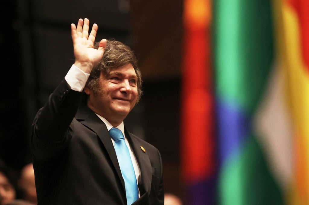 Argentina’s President Javier Milei waves as he attends an event in La Paz, Bolivia, in November. Photo: AP