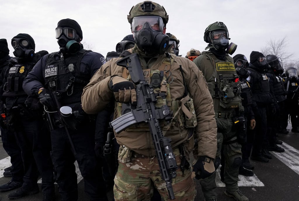 US Customs and Border Protection and other law enforcement officials stand guard in front of the Bishop Henry Whipple Federal Building in Minneapolis, Minnesota. Photo: Reuters US Customs and Border Protection and other law enforcement officials stand guard in front of the Bishop Henry Whipple Federal Building in Minneapolis, Minnesota. Photo: Reuters