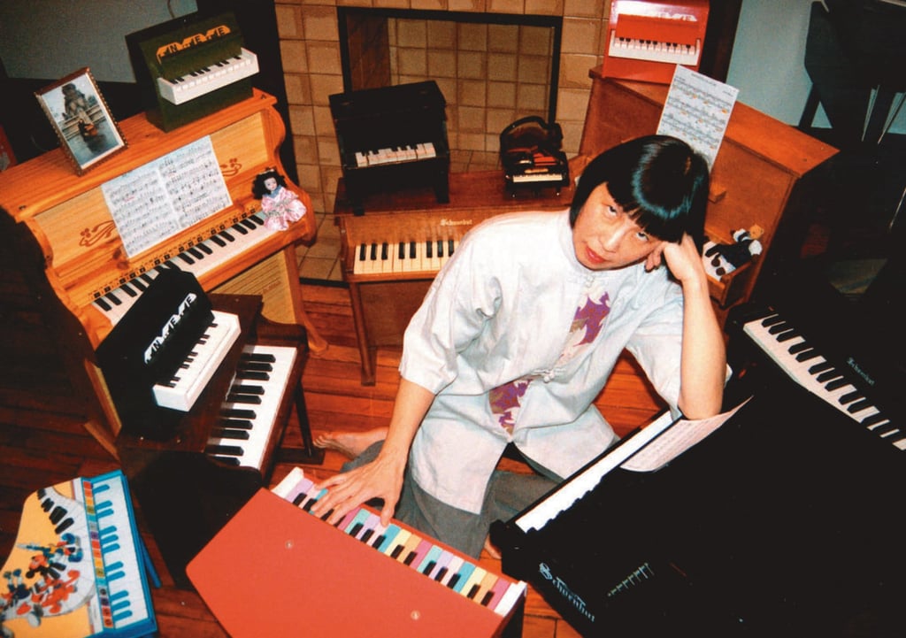 Tan with a collection of toy pianos. It was John Cage’s “Suite for Toy Piano” (1948) that redirected her from the grand to the toy piano.