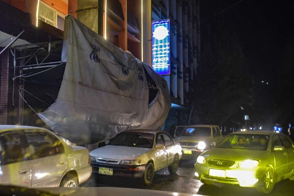 Within hours of the blast the street was reopened to traffic, with cars streaming past the restaurant’s covered entrance. Photo: AFP