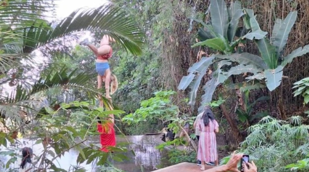 A couple, left of centre, perform acro-yoga at the ancient site in Chiang Mai. Photo: Thaiger A couple, left of centre, perform acro-yoga at the ancient site in Chiang Mai. Photo: Thaiger