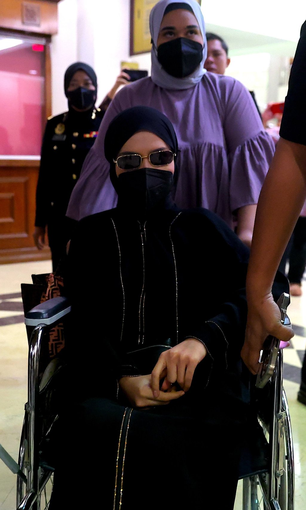 Salwani Anuar enters court in a wheelchair on Thursday. Photo: EPA Salwani Anuar enters court in a wheelchair on Thursday. Photo: EPA